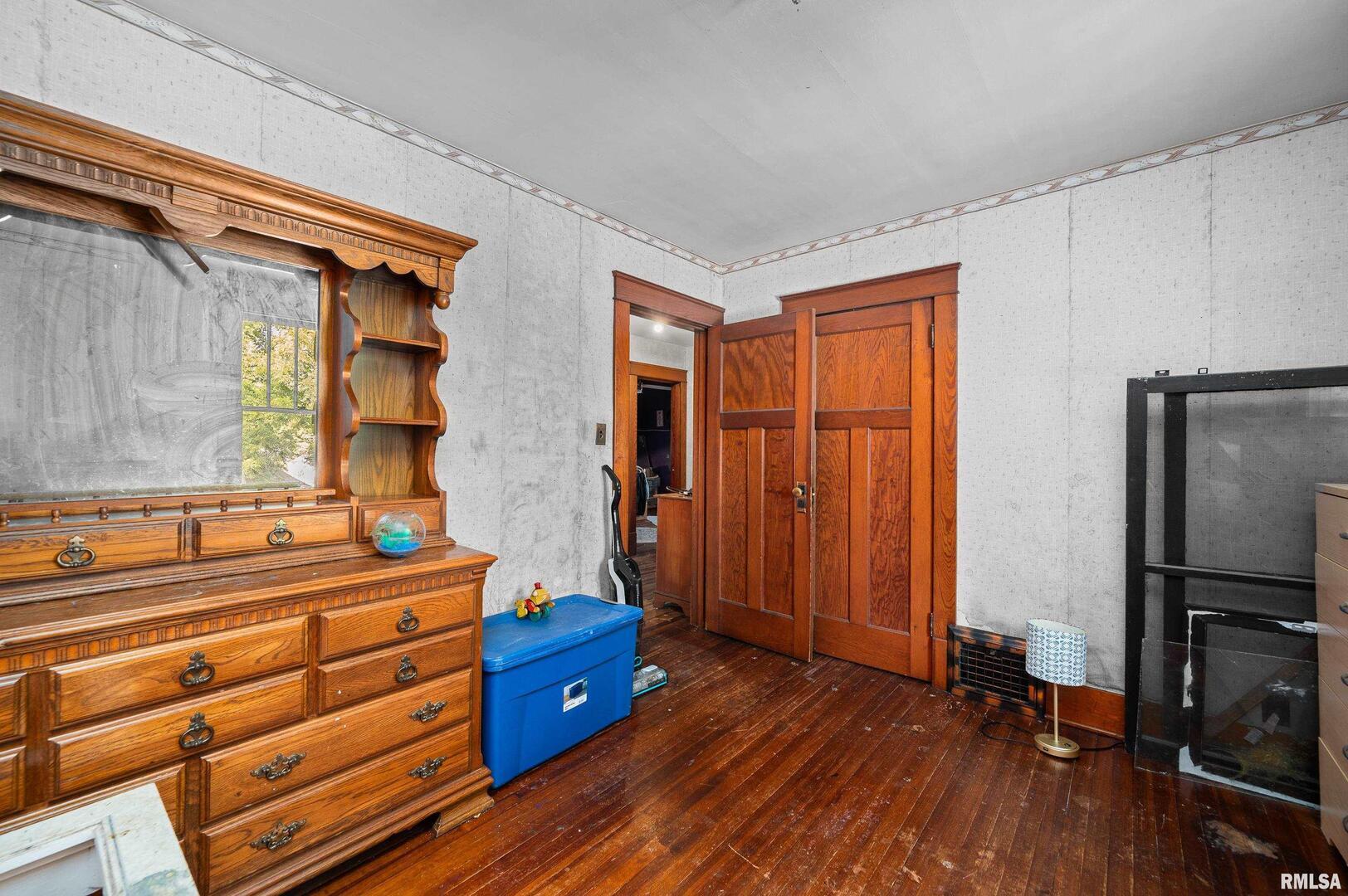 415 Southwest 4th Avenue Galva, IL 61434 - Photo 33 of 38 a room with a dresser and a window
