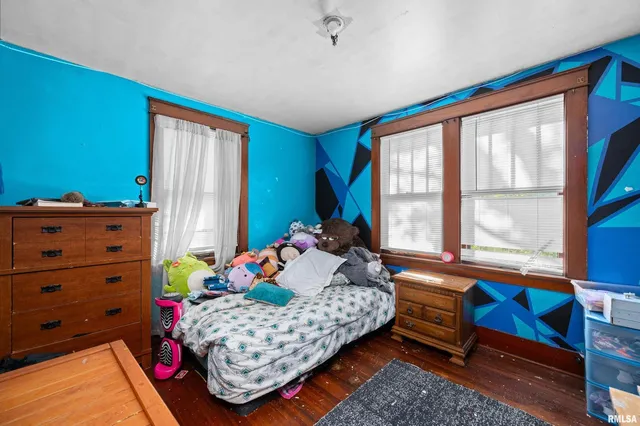 a bedroom with furniture and a bed