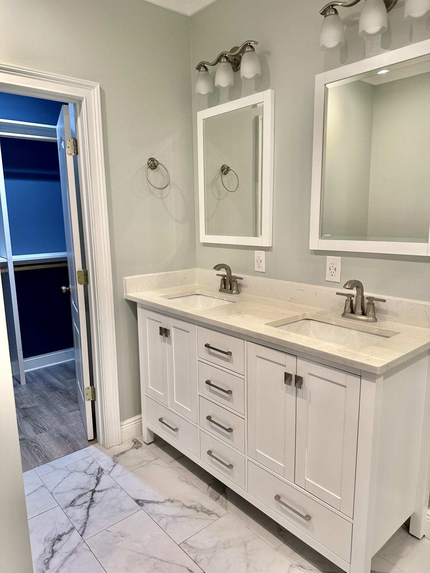 49 Wish Lane Santa Rosa Beach, FL 32459 - Photo 13 of 26 a spacious bathroom with a double vanity sink and a mirror