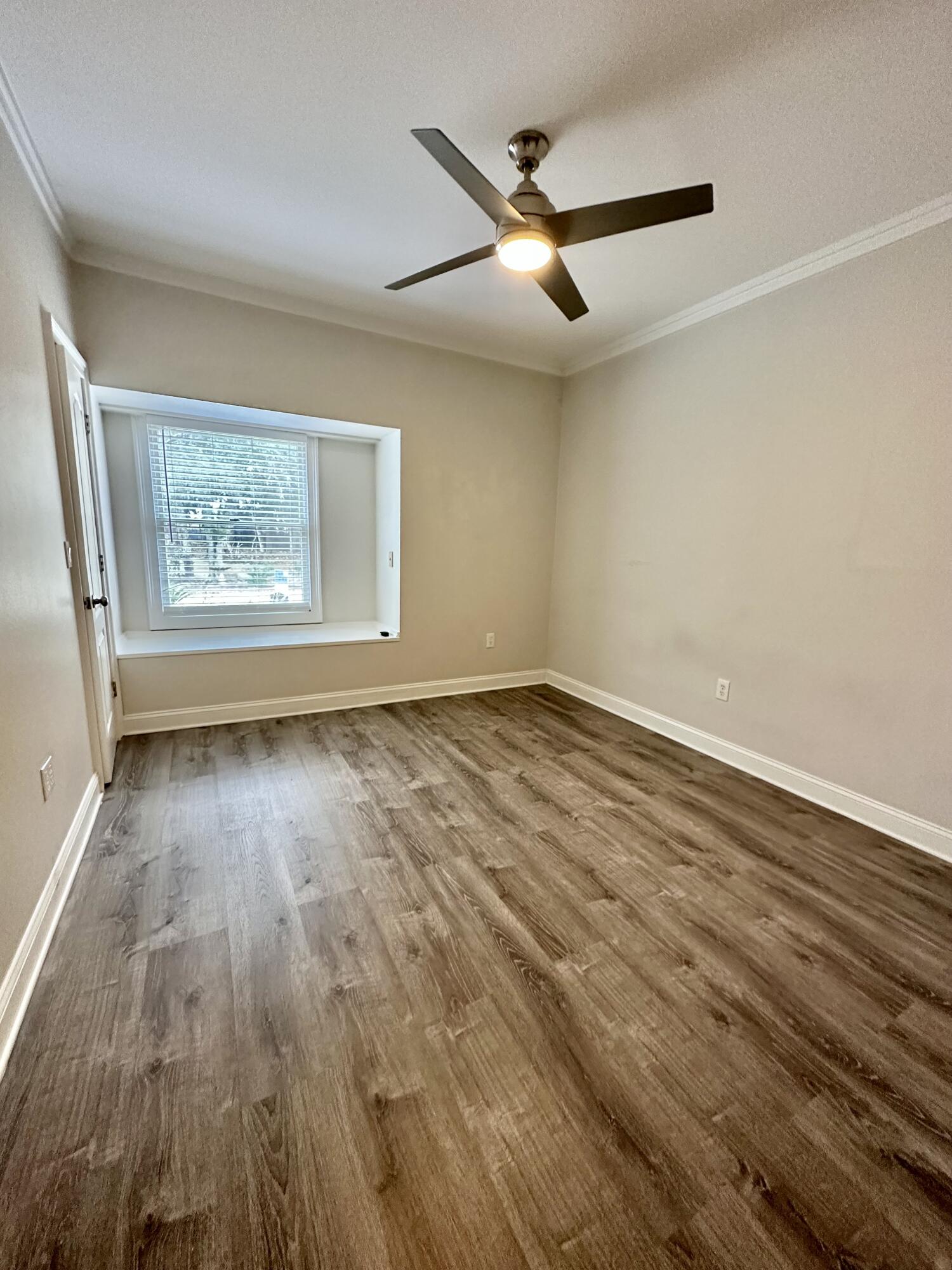 49 Wish Lane Santa Rosa Beach, FL 32459 - Photo 14 of 26 wooden floor in an empty room with a window