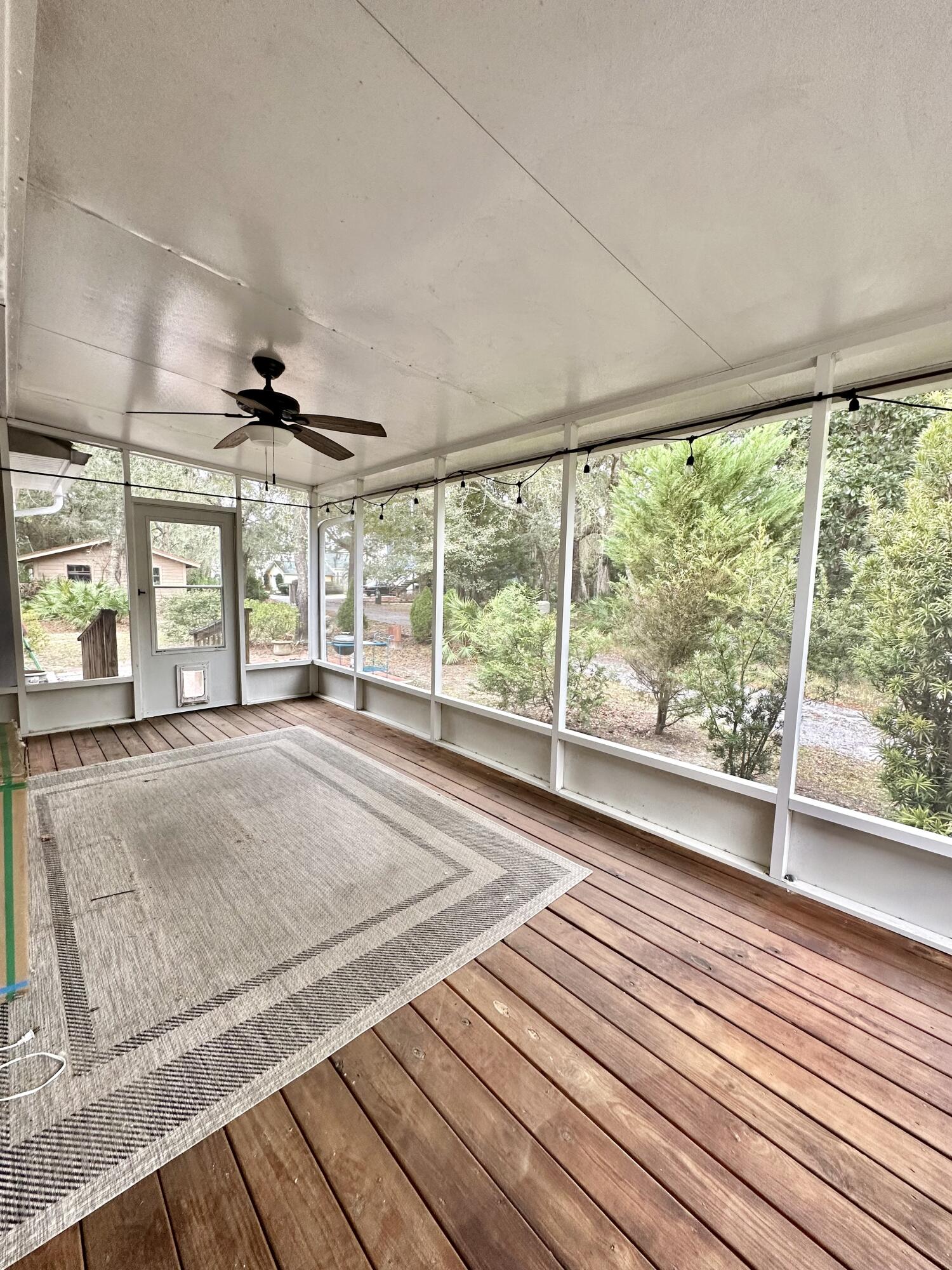 49 Wish Lane Santa Rosa Beach, FL 32459 - Photo 18 of 26 a view of a room with wooden floor and windows