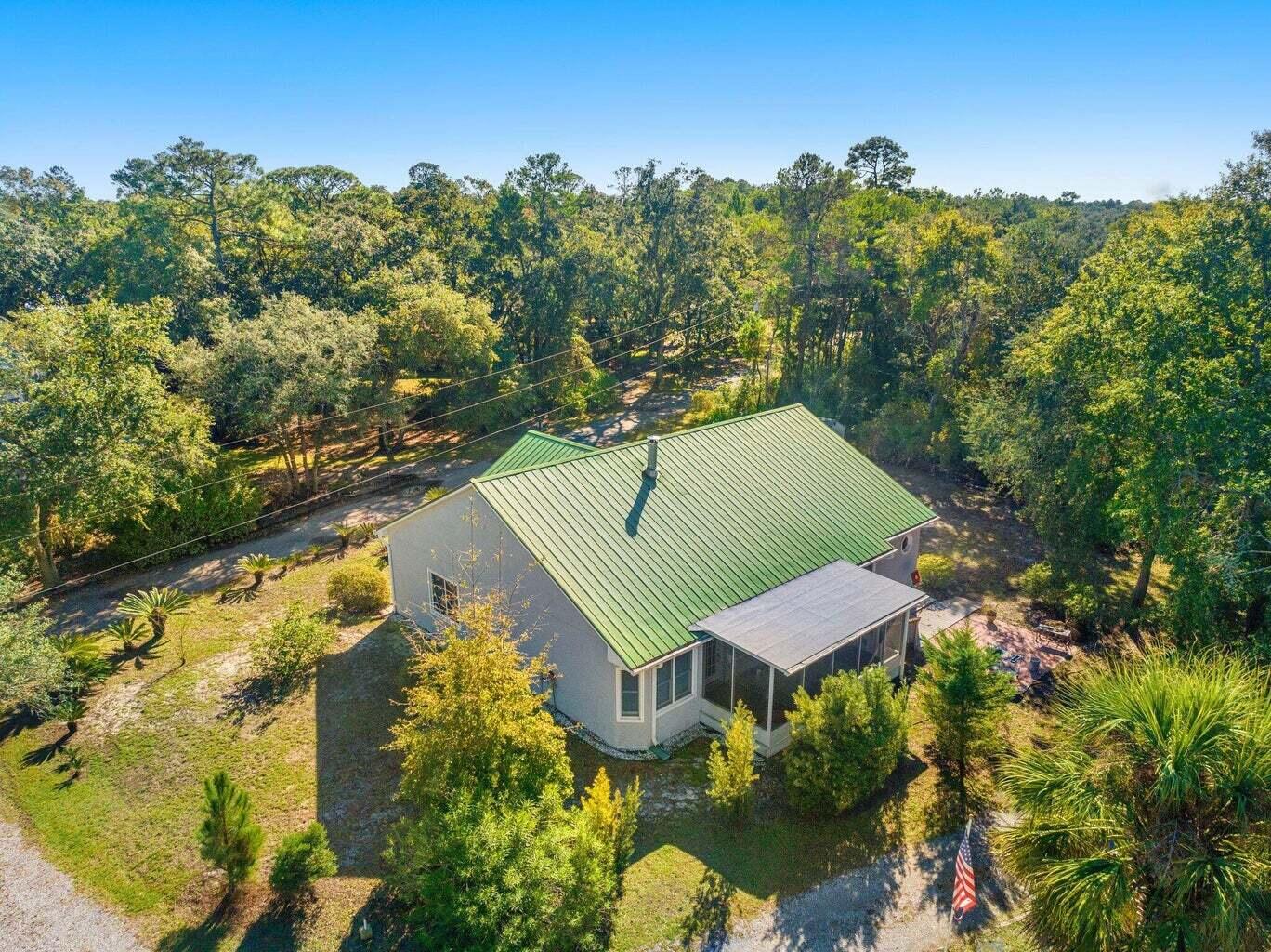 49 Wish Lane Santa Rosa Beach, FL 32459 - Photo 2 of 26 a view of a lake with a yard