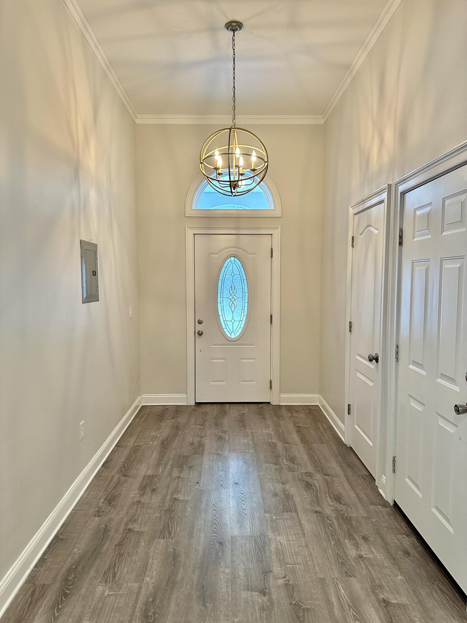 49 Wish Lane Santa Rosa Beach, FL 32459 - Photo 5 of 26 a view of an empty room with window and wooden floor