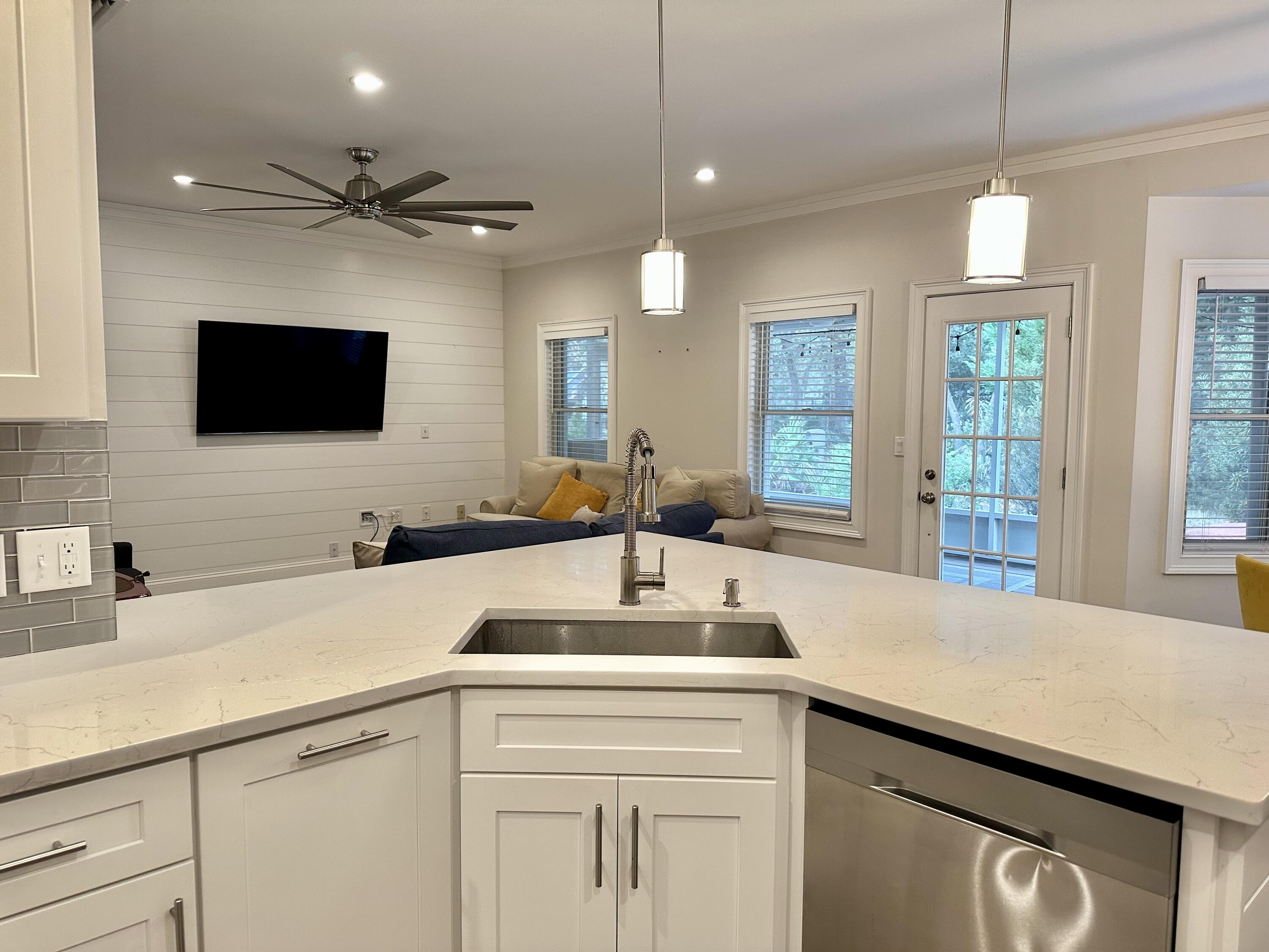 49 Wish Lane Santa Rosa Beach, FL 32459 - Photo 7 of 26 a kitchen with a sink and a wooden floor
