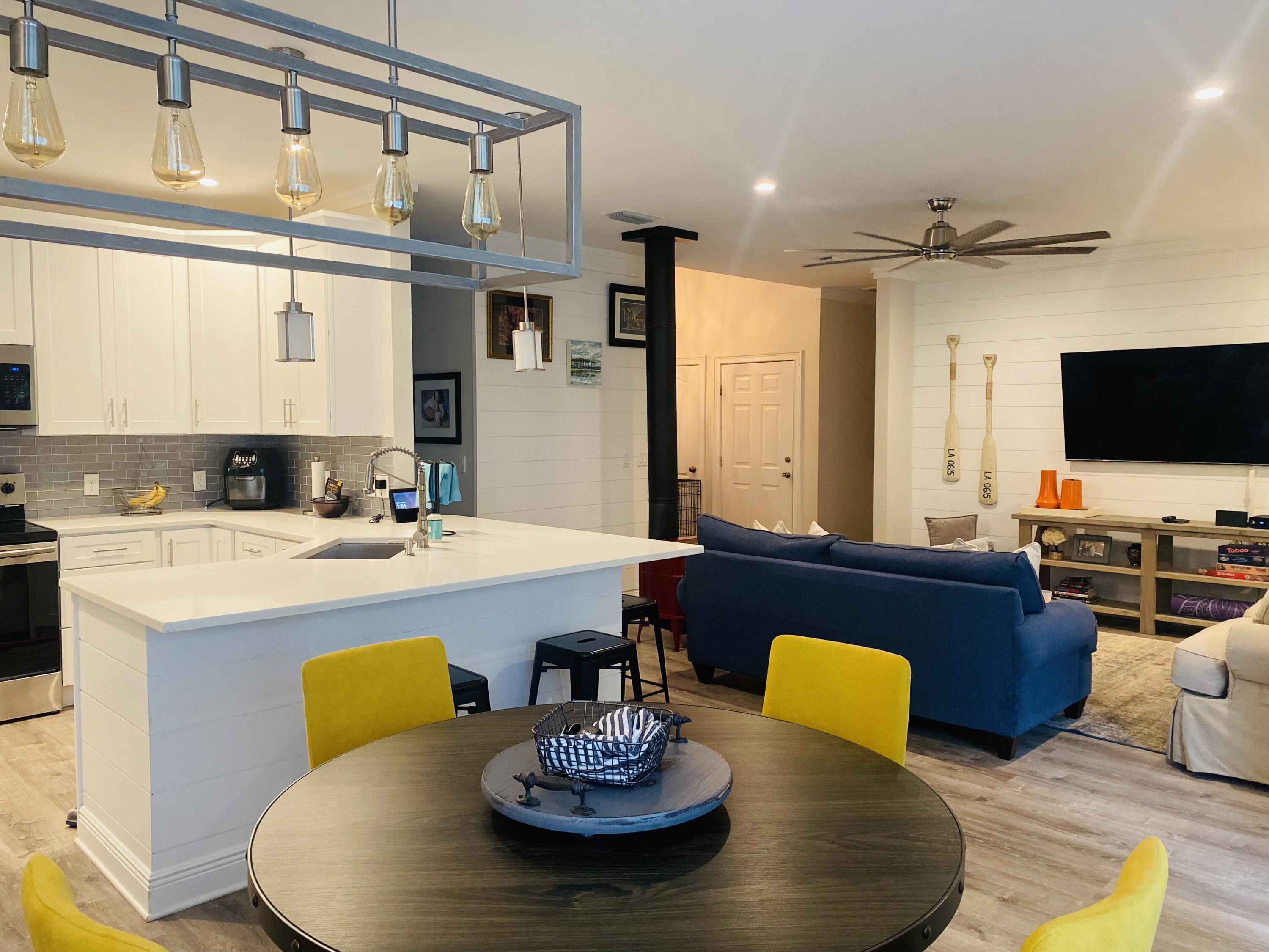 49 Wish Lane Santa Rosa Beach, FL 32459 - Photo 26 of 26 a living room with kitchen countertops and a flat screen tv