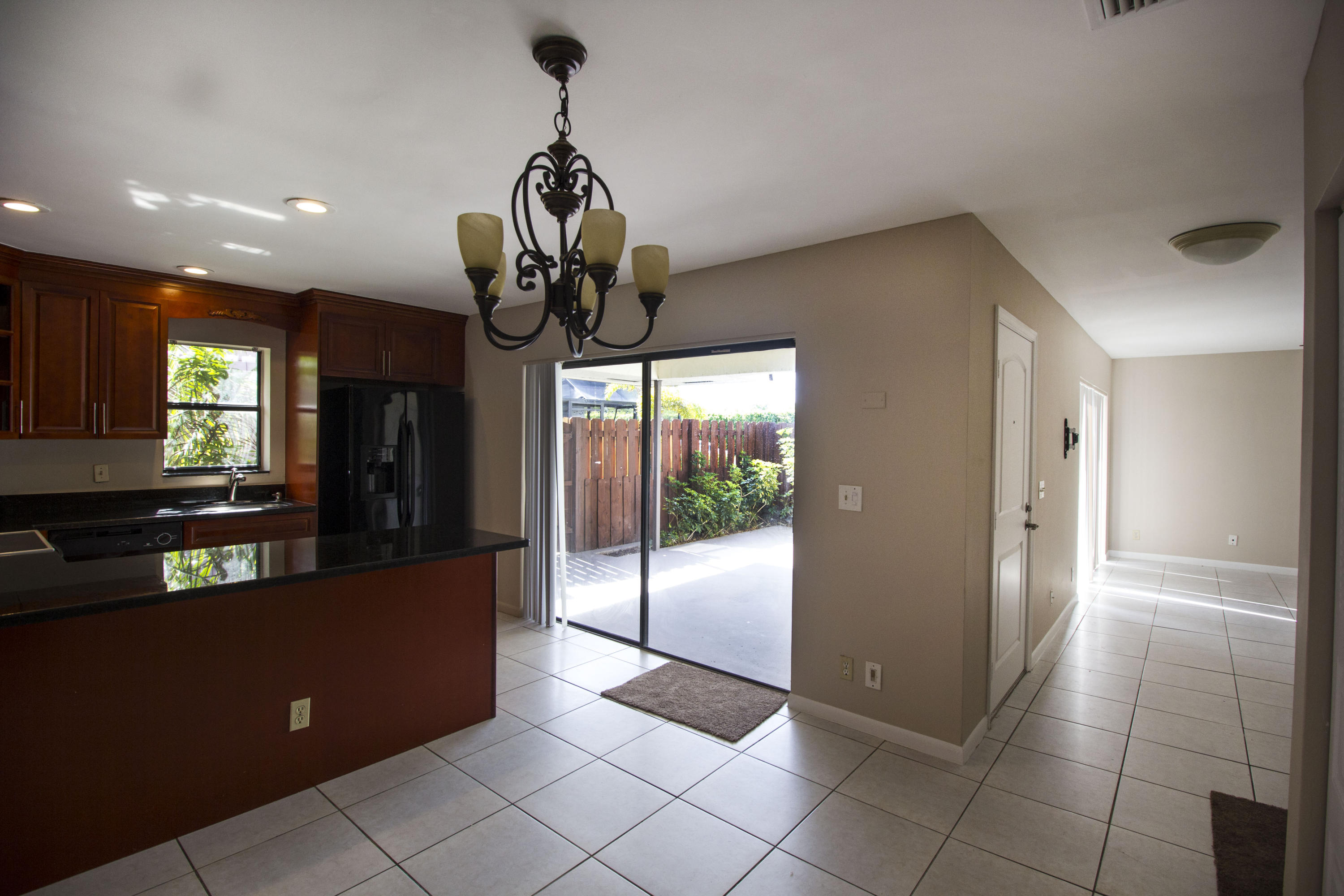 7619 Courtyard Run West Boca Raton, FL 33433 - Photo 10 of 20 KITCHEN LIVING ROOM