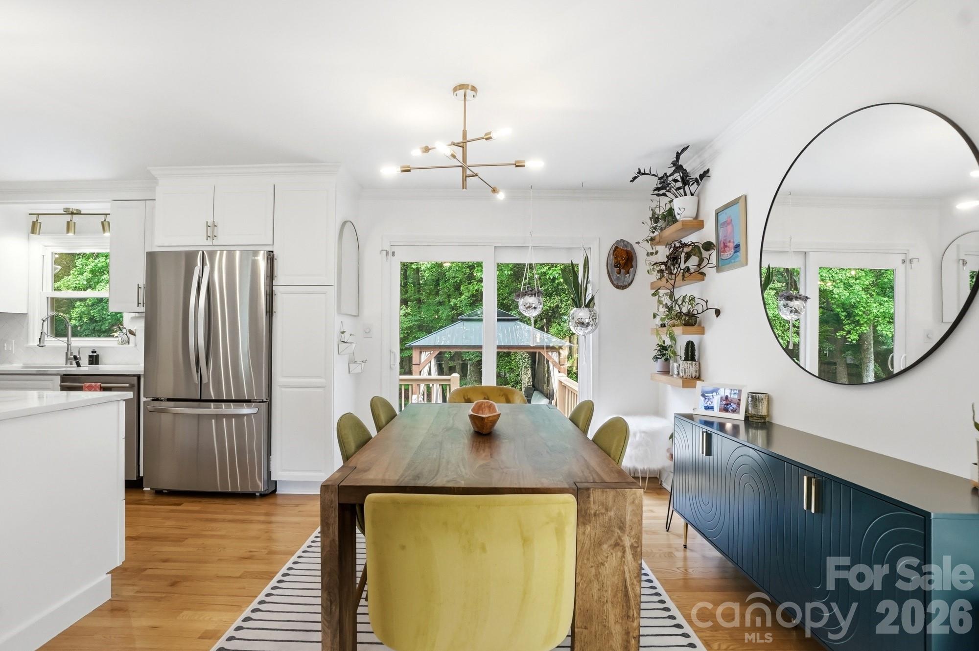 824 Riverwood Road Charlotte, NC 28270 - Photo 9 of 37 a view of a dining room with furniture window and wooden floor