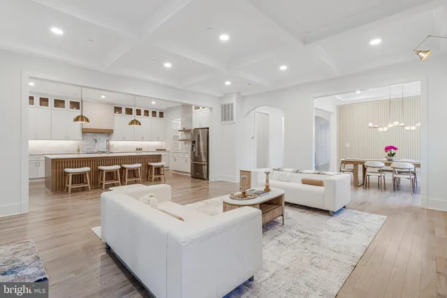 a kitchen with stainless steel appliances granite countertop a stove and a large kitchen island