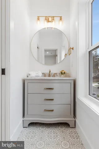 a view of a dining room with furniture large windows and wooden floor