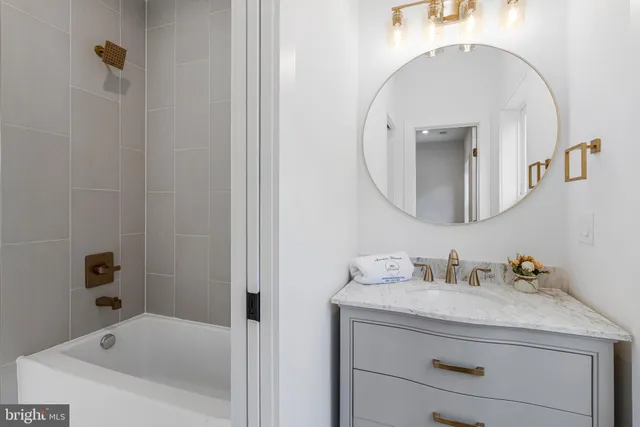 front view of a house with a chairs and table in the patio
