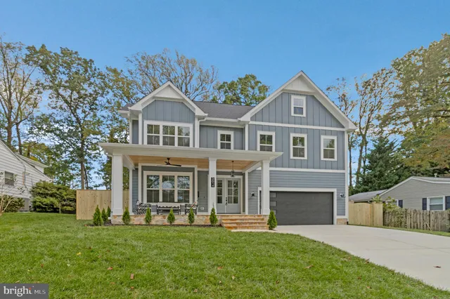 a view of a hallway view with wooden floor and staircase