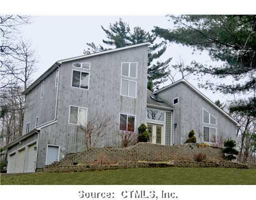 83 Beacon Road Bethany, CT 06524 - Photo 1 of 1 a view of a house with a yard