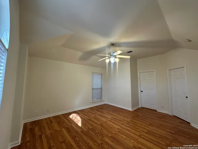 a bathroom with a sink mirror and a bathtub