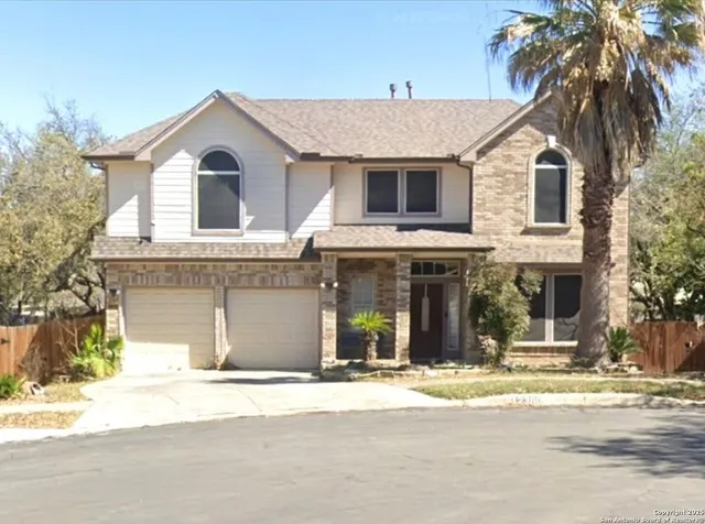 a view of a white house with a large windows