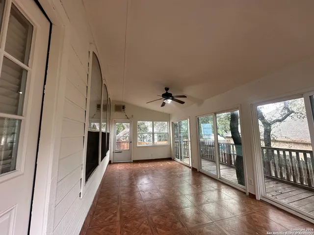 a view of a balcony with wooden floor