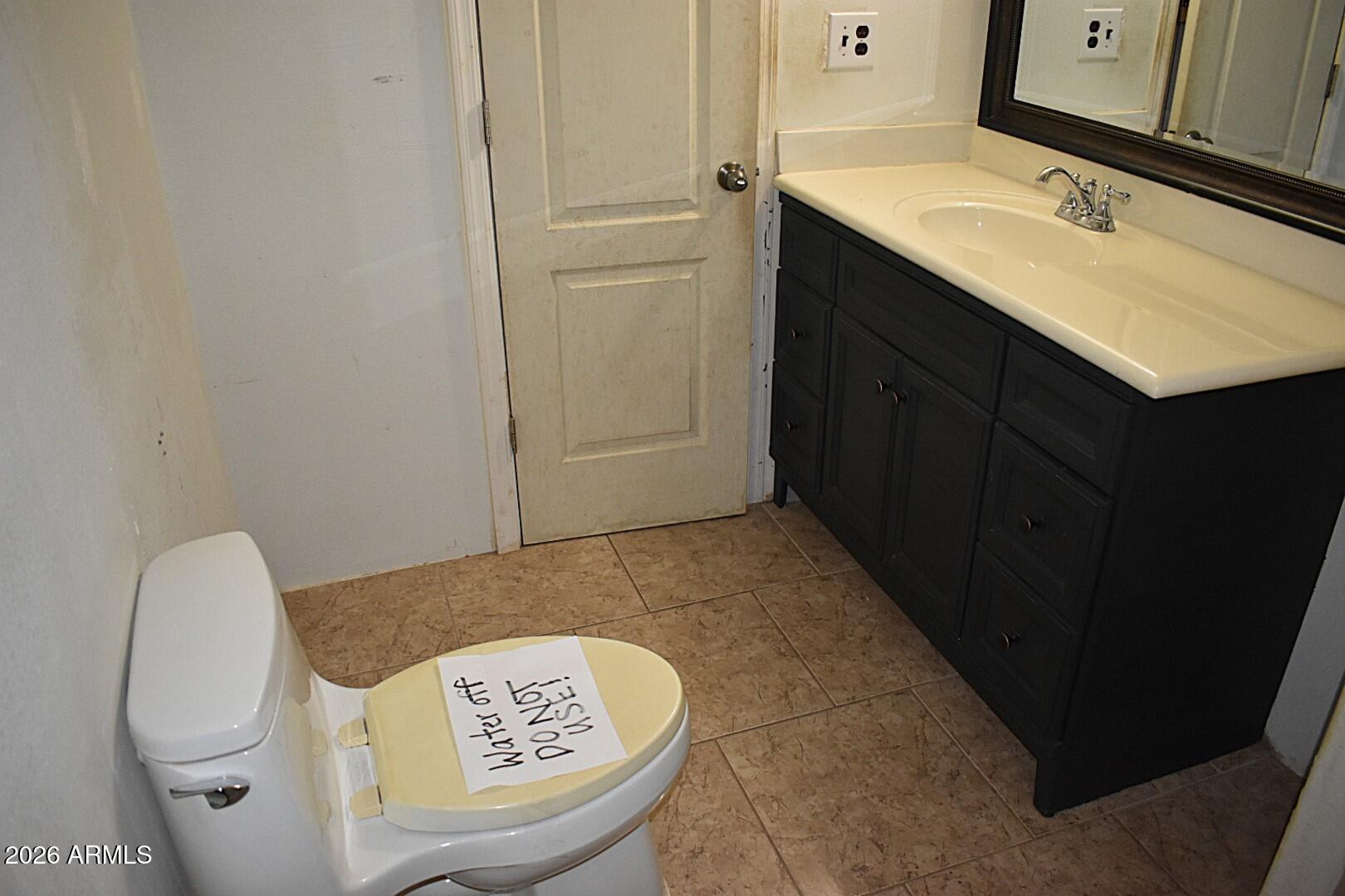 8138 Butte Street Mesa, AZ 85207 - Photo 11 of 27 a bathroom with a sink and mirror