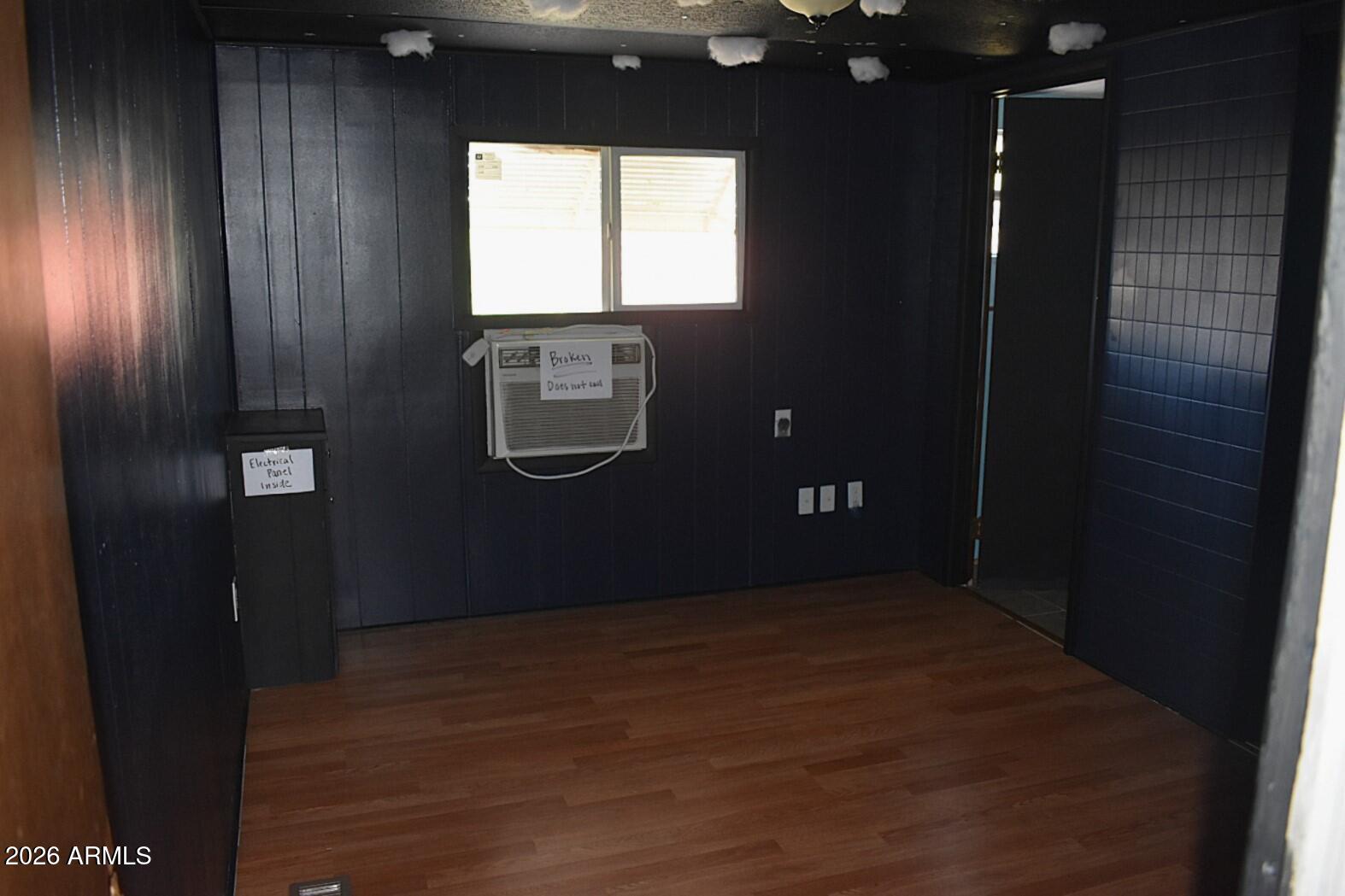 8138 Butte Street Mesa, AZ 85207 - Photo 12 of 27 a view of an empty room with wooden floor