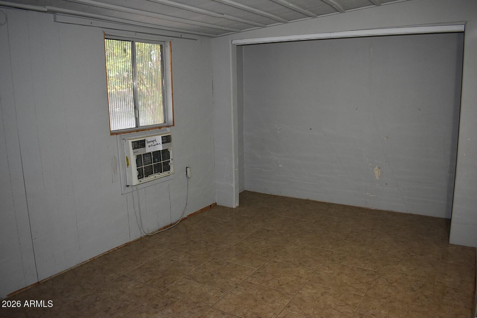 8138 Butte Street Mesa, AZ 85207 - Photo 9 of 27 a view of an empty room with a window