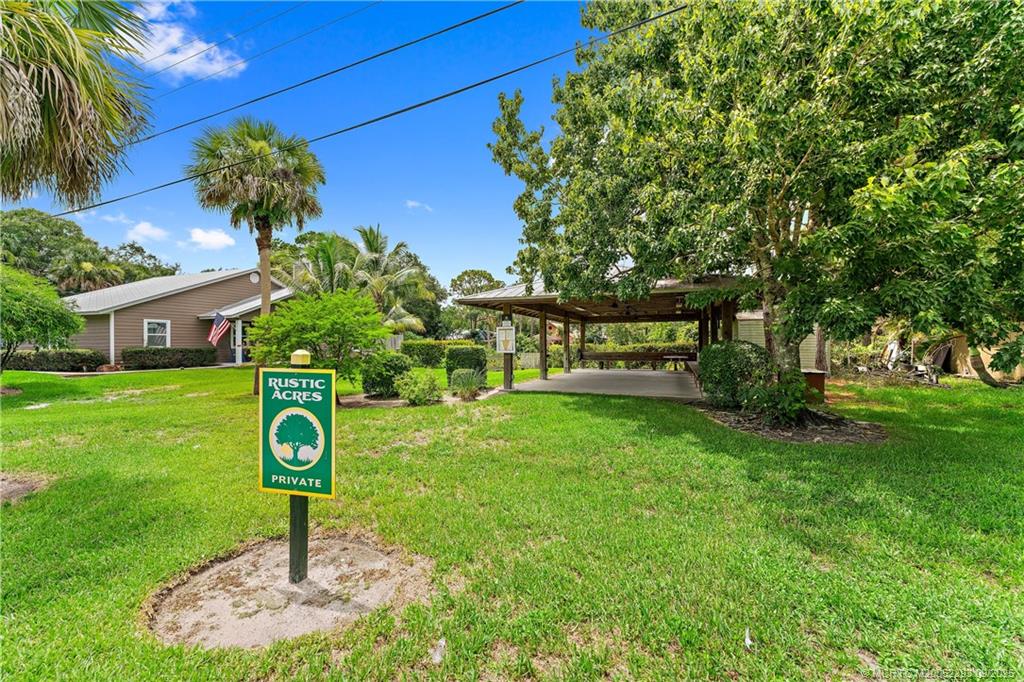 815 Southwest Rustic Circle Stuart, FL 34997 - Photo 18 of 20 a front view of a house with garden