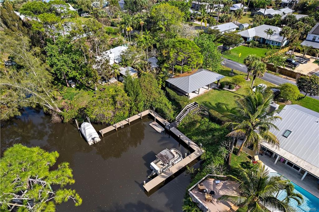 815 Southwest Rustic Circle Stuart, FL 34997 - Photo 19 of 20 an aerial view of a house with a yard