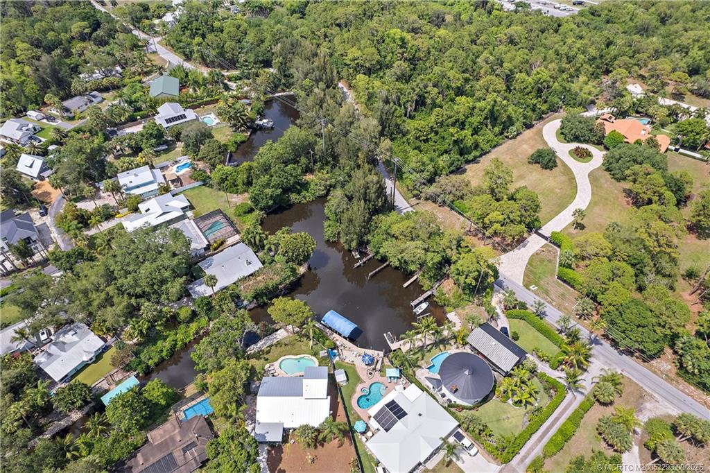 815 Southwest Rustic Circle Stuart, FL 34997 - Photo 20 of 20 an aerial view of a house with a yard