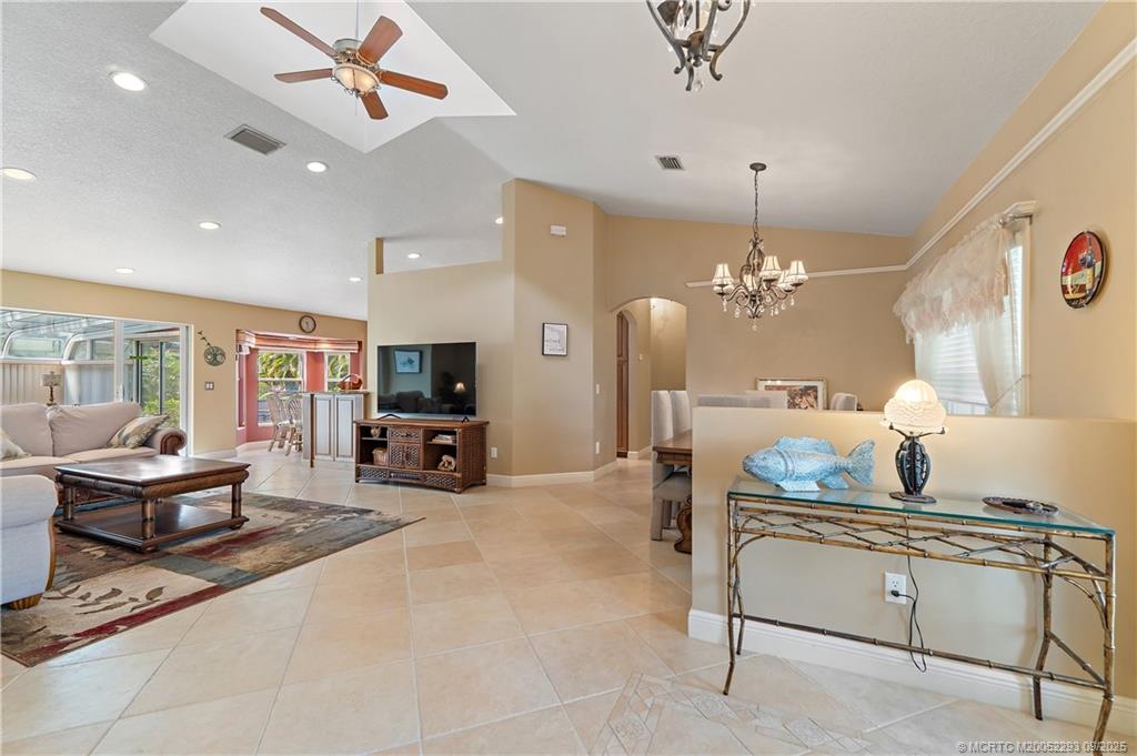 815 Southwest Rustic Circle Stuart, FL 34997 - Photo 4 of 20 a living room with furniture and a flat screen tv