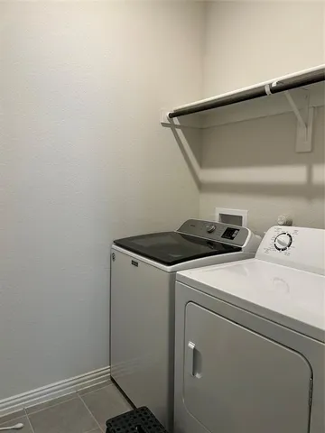 a bathroom with a double vanity sink mirror double and shower