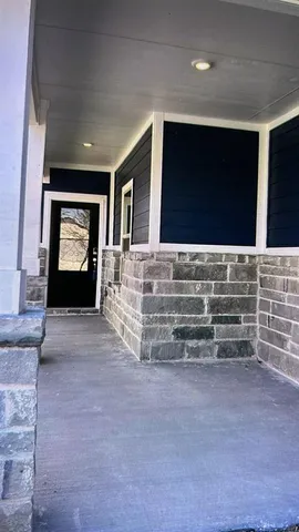 a living room with fireplace furniture and a flat screen tv