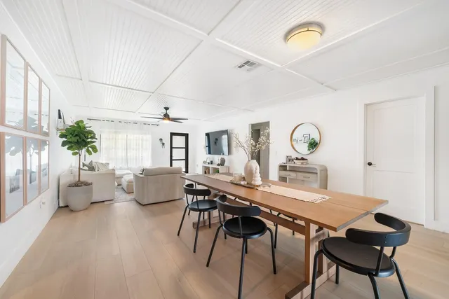 a view of a dining room with furniture and window