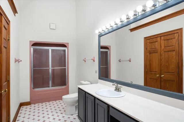 a bathroom with a sink double vanity and a mirror