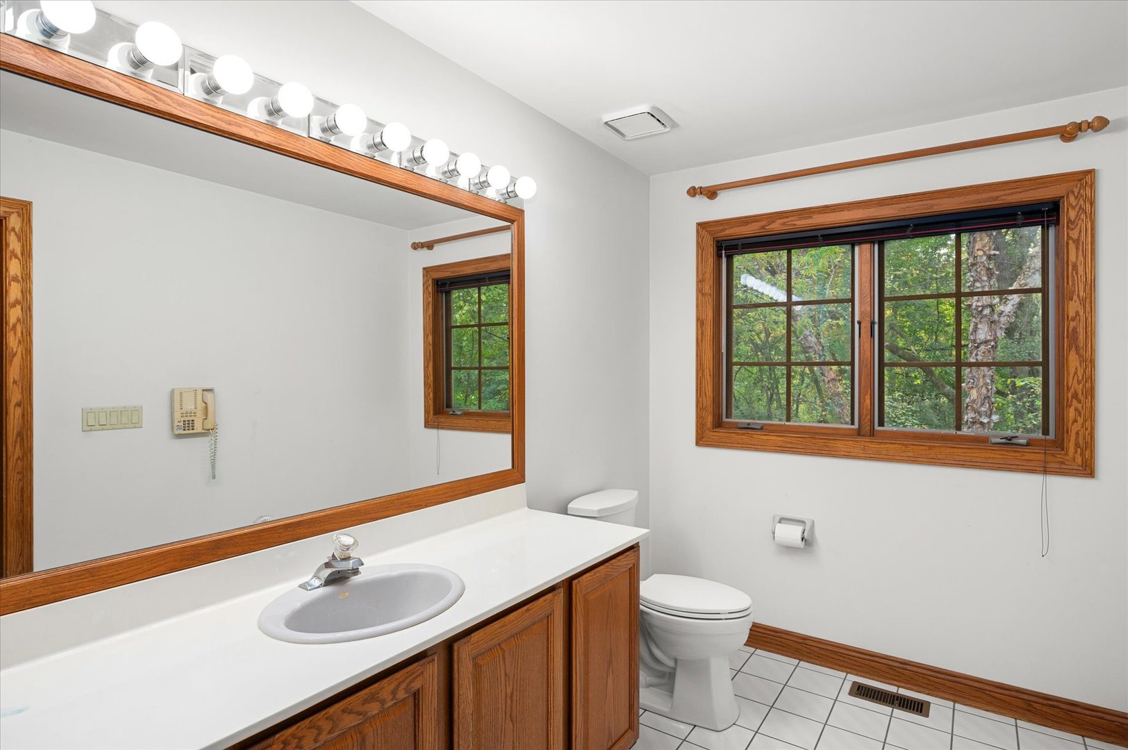 5N847 Surrey Road Wayne, IL 60184 - Photo 36 of 45 a bathroom with a sink a toilet and a mirror