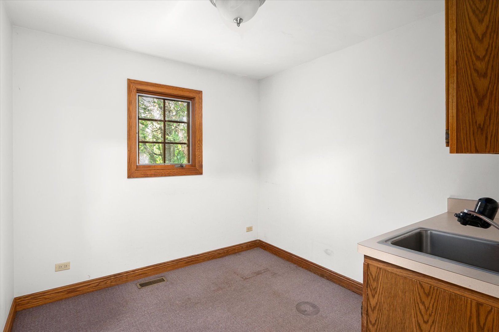 5N847 Surrey Road Wayne, IL 60184 - Photo 39 of 45 a view of a room that has a window in it