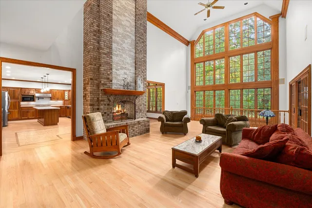 a large kitchen with a large counter top stainless steel appliances and cabinets