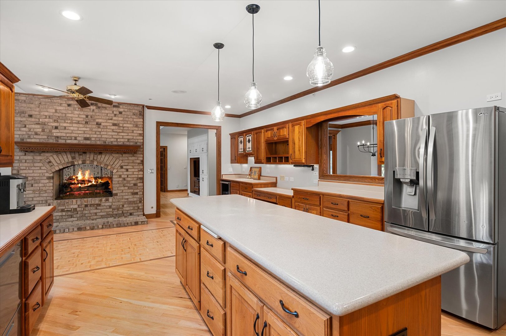 5N847 Surrey Road Wayne, IL 60184 - Photo 9 of 45 a large kitchen with kitchen island a large counter top space a sink stainless steel appliances and cabinets