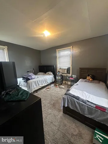a bathroom with a tub sink and window