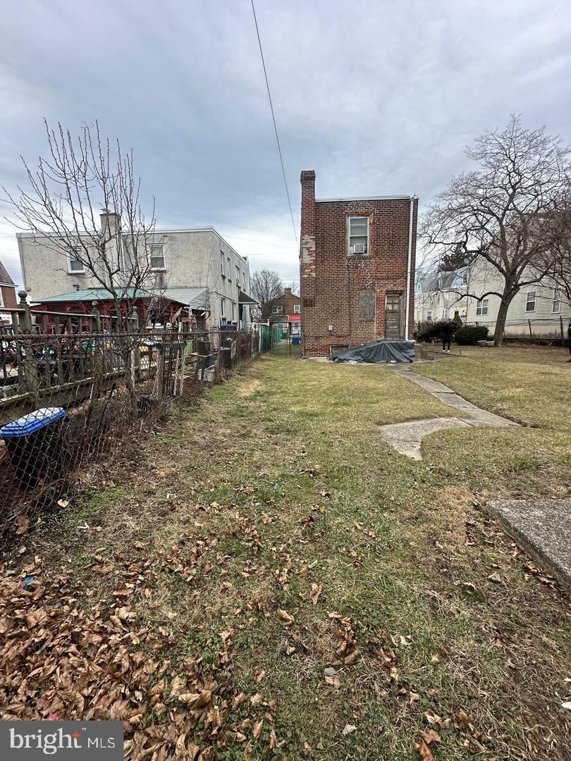 7538 Forrest Avenue Philadelphia, PA 19150 - Photo 6 of 16 a view of a house with a yard and garage