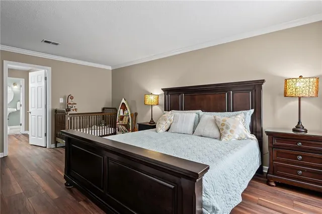 a bed room with a bed and dresser