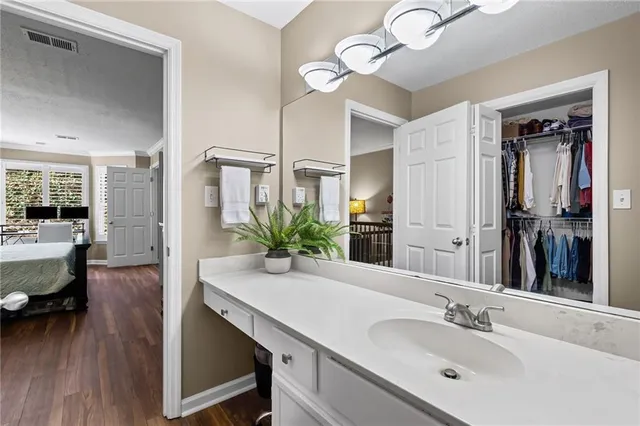 a bathroom with a sink and a mirror