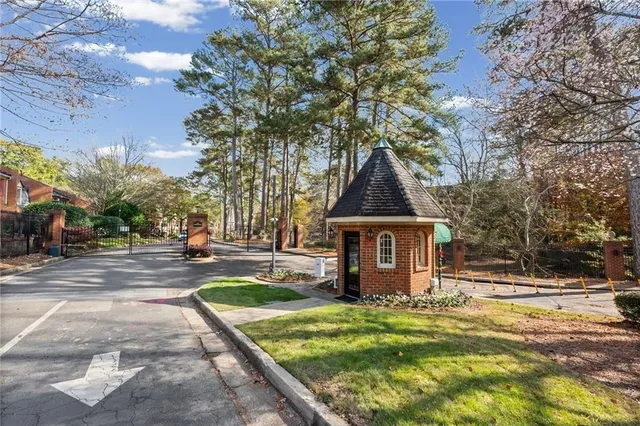 a front view of a house with a yard fountain