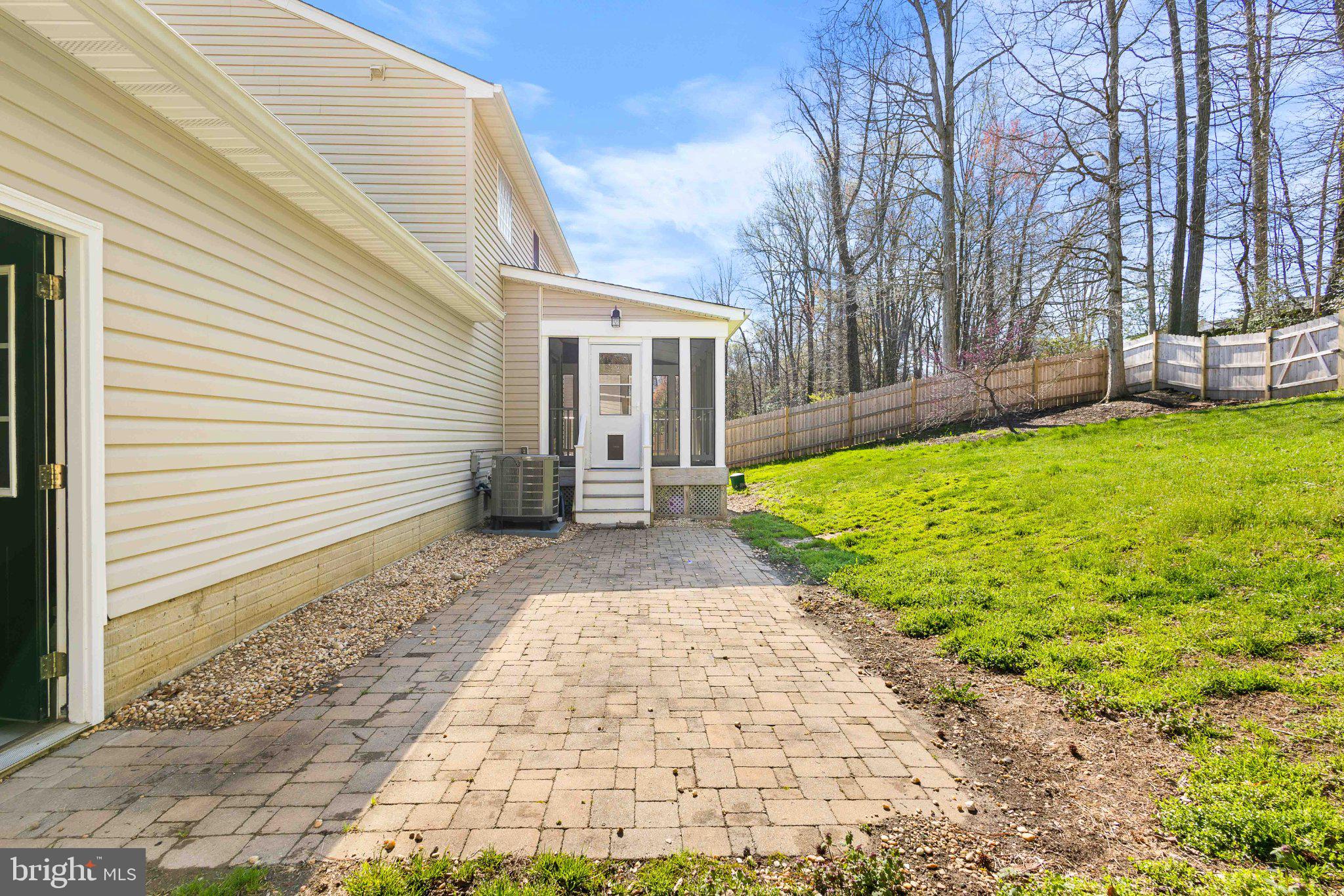 9084 Mullen Road King George, VA 22485 - Photo 17 of 41 Charming patio with lush green backdrop.