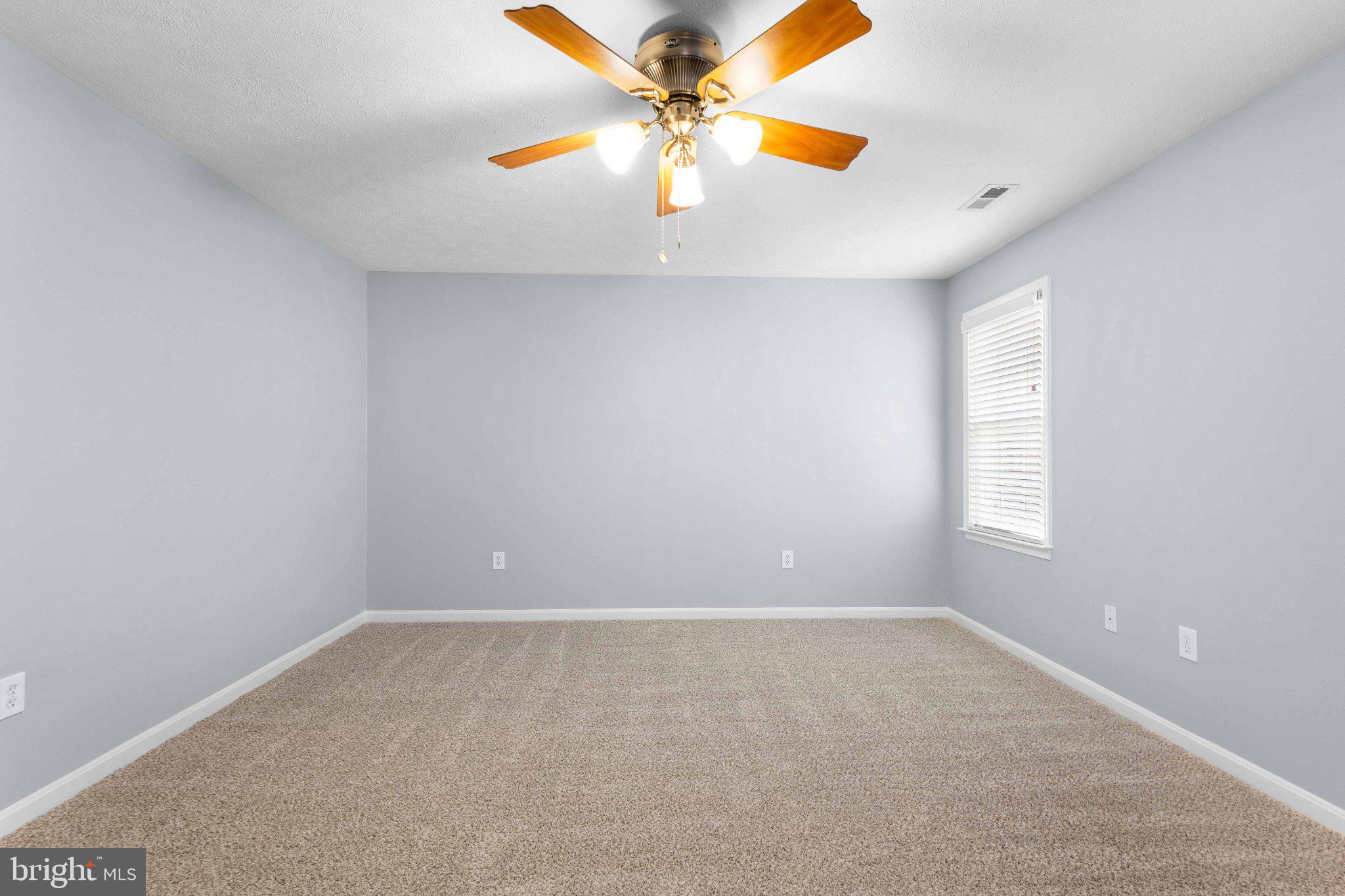 9084 Mullen Road King George, VA 22485 - Photo 36 of 41 Spacious room with soft lighting.