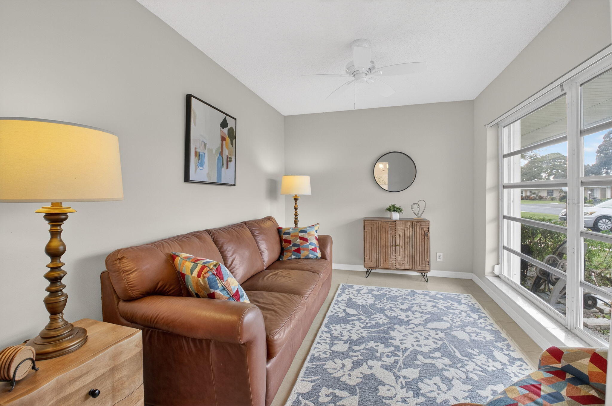 8633 Chevy Chase Drive Boca Raton, FL 33433 - Photo 16 of 43 a living room with furniture and a fireplace