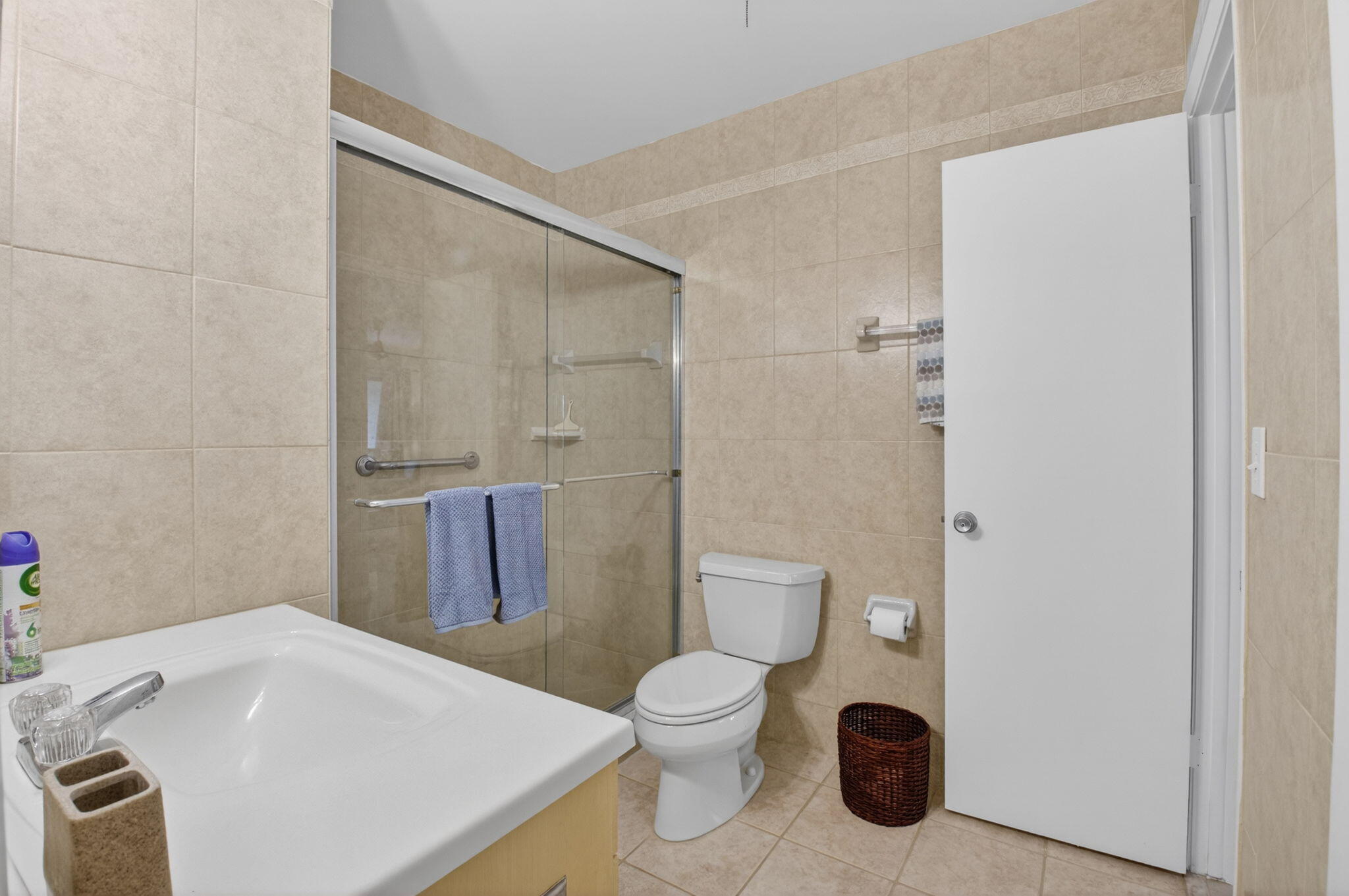 8633 Chevy Chase Drive Boca Raton, FL 33433 - Photo 21 of 43 a bathroom with a sink a toilet and shower