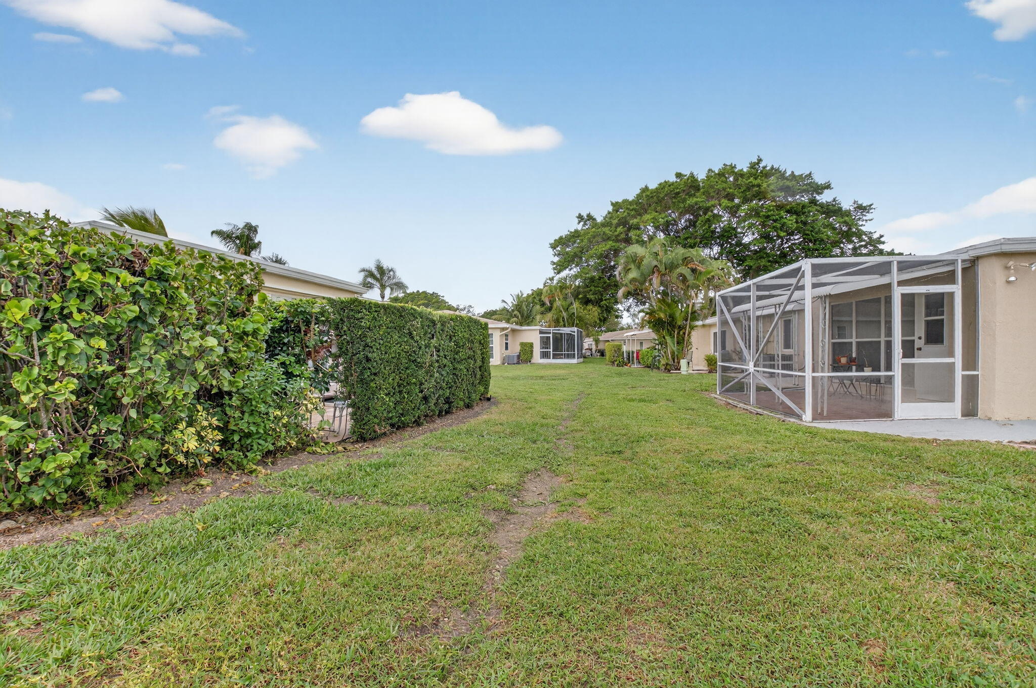 8633 Chevy Chase Drive Boca Raton, FL 33433 - Photo 27 of 43 a view of a house with a backyard