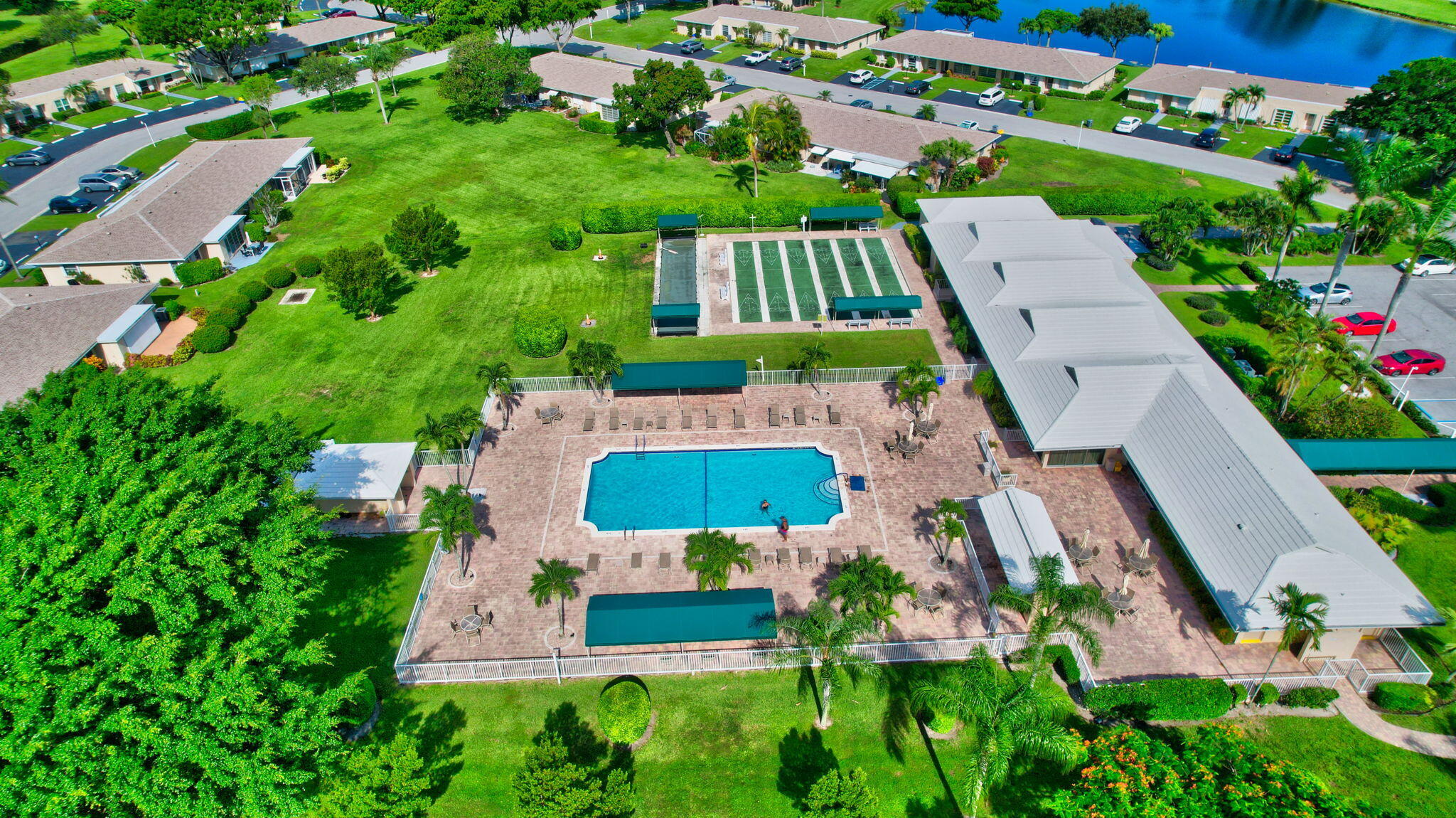 8633 Chevy Chase Drive Boca Raton, FL 33433 - Photo 36 of 43 an aerial view of house with swimming pool outdoor seating and yard