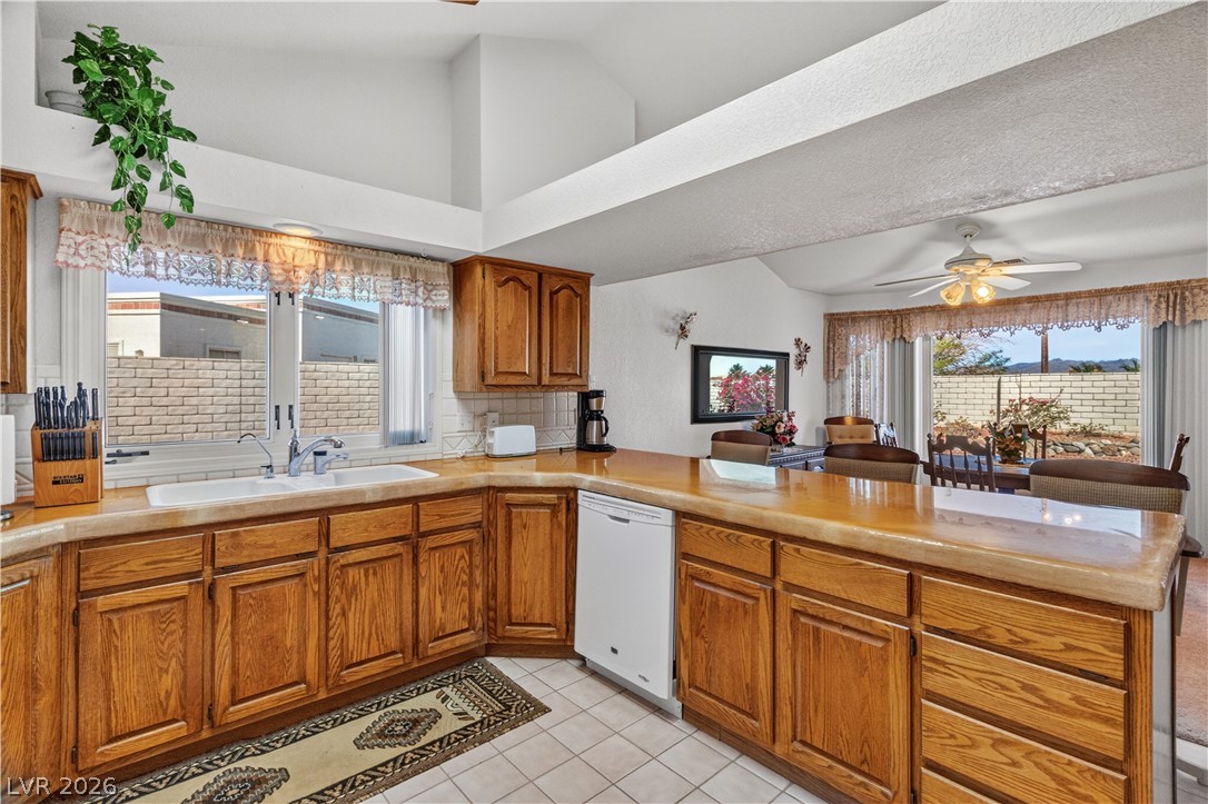 2055 Cholla Way Laughlin, NV 89029 - Photo 15 of 87 Culinary creativity awaits in this kitchen, boasting ample counter space and abundant cabinetry, flowing into a bright dining area.