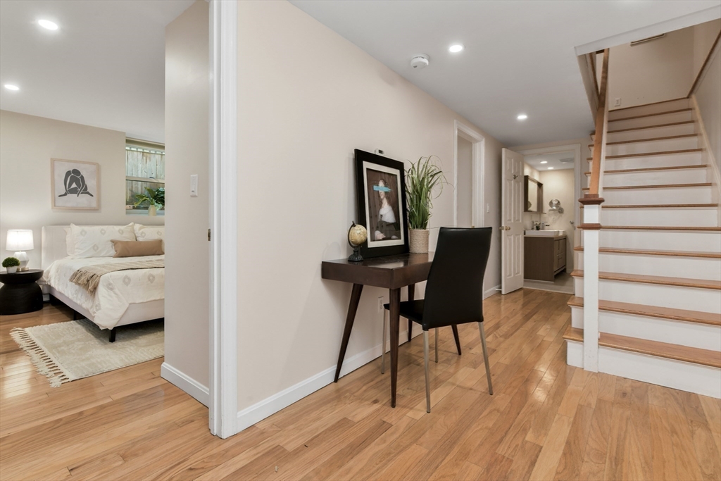 111 Inman Street, Unit A Cambridge, MA 02139 - Photo 11 of 18 a living room with furniture and a wooden floor