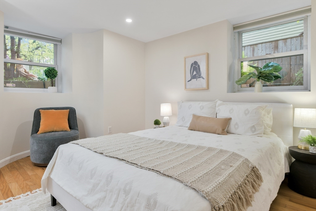 111 Inman Street, Unit A Cambridge, MA 02139 - Photo 12 of 18 a bedroom with a bed and window