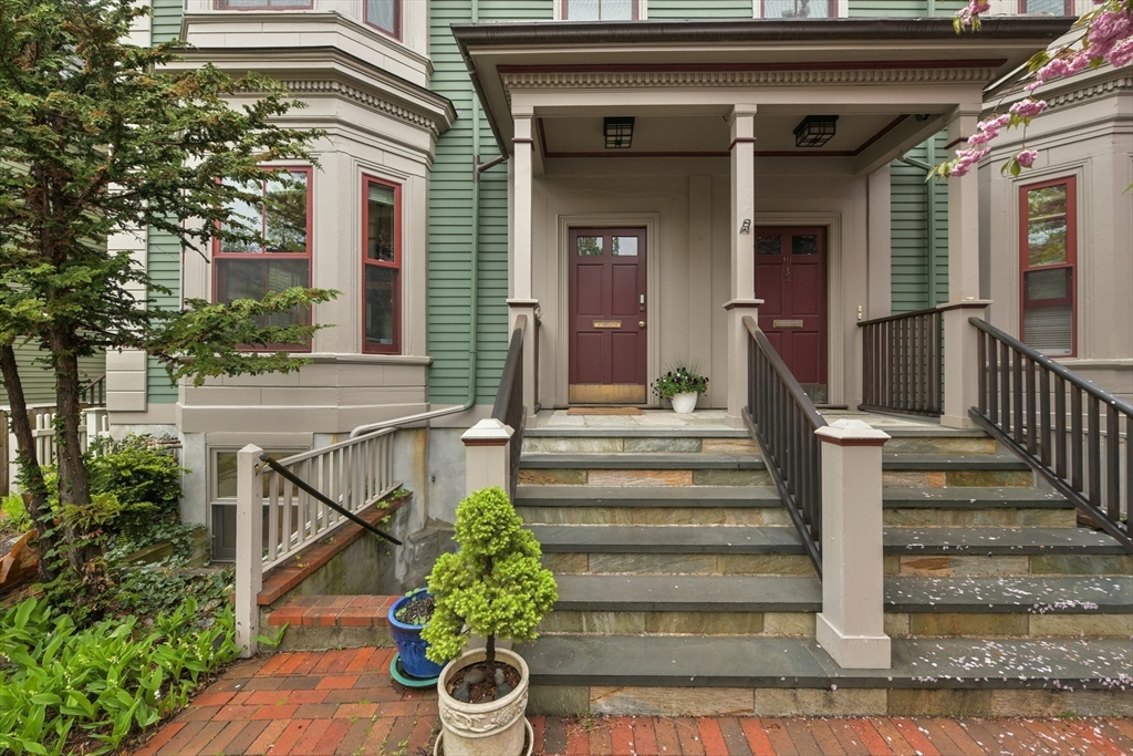 111 Inman Street, Unit A Cambridge, MA 02139 - Photo 17 of 18 a front view of a house with a yard