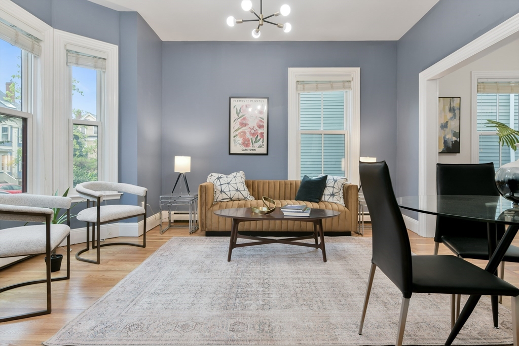 111 Inman Street, Unit A Cambridge, MA 02139 - Photo 3 of 18 a living room with furniture and a window
